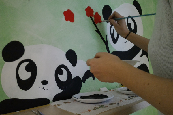 Panda dipinti sul muro